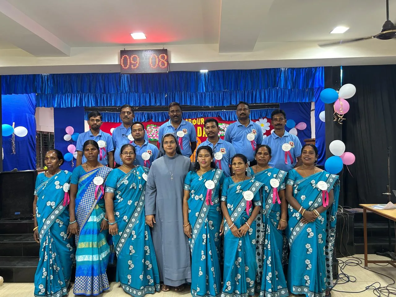 Principal addressing students on the importance of labour during May Day celebration